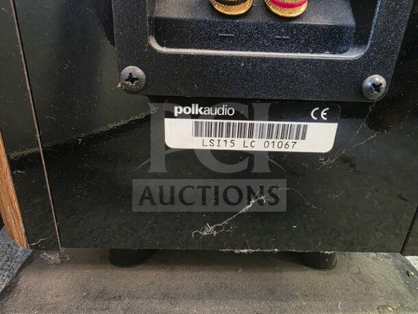 Polk Audio LSi15 Tower Speaker back panel, showing wire terminals and label with model number LS115 LC 01067. Dust present.