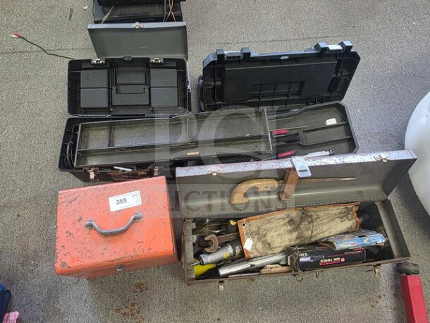 Lot of miscellaneous tools in various toolboxes, including wrenches and a saw. Condition: used, sold as is.