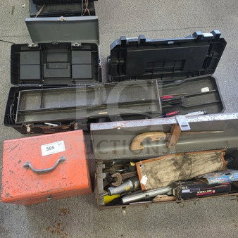 Lot of miscellaneous tools in various toolboxes, including wrenches and a saw. Condition: used, sold as is.