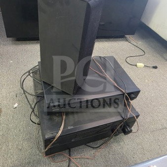 Lot of miscellaneous electronics including speakers and stacked audio components. Visible wear, sold as is.