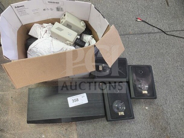 Lot of miscellaneous electronics including black speakers and assorted components in a brown box. Box labeled with "358."