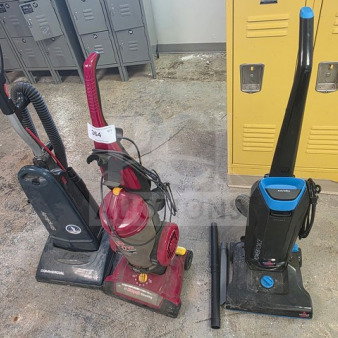 Lot of 3 vacuum cleaners, various brands and models, sold as is. Visible wear and dirt. Includes upright and canister types.