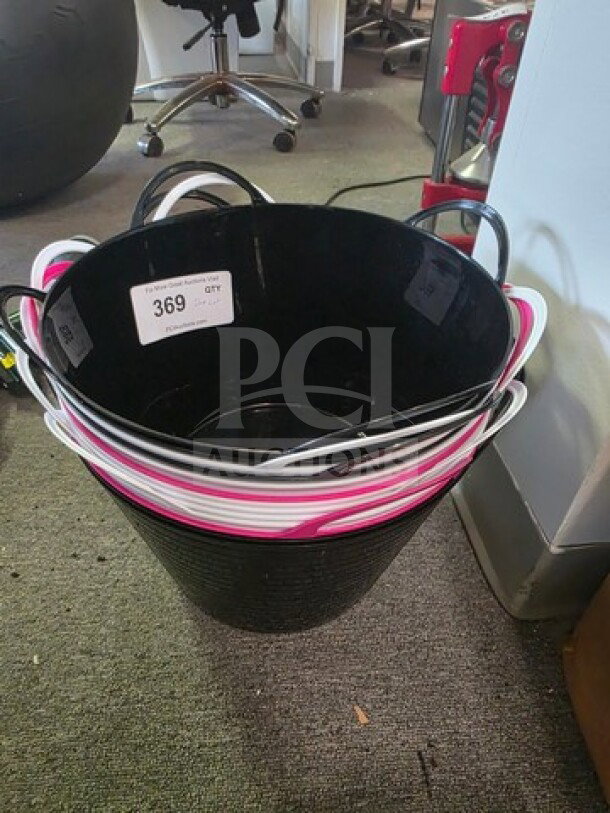 A lot of outdoor flexible storage tubs, black and pink, stacked; each with dual handles. Tag reads "369 QTY."