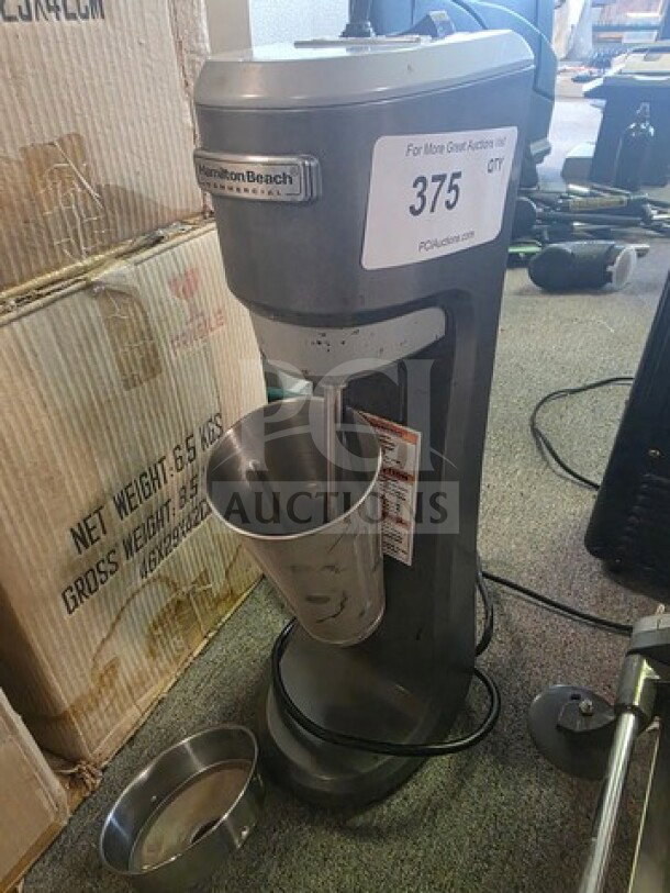 Hamilton Beach Commercial HMD200 Drink Mixer, gray, used condition, with stainless steel cup and visible power cord.