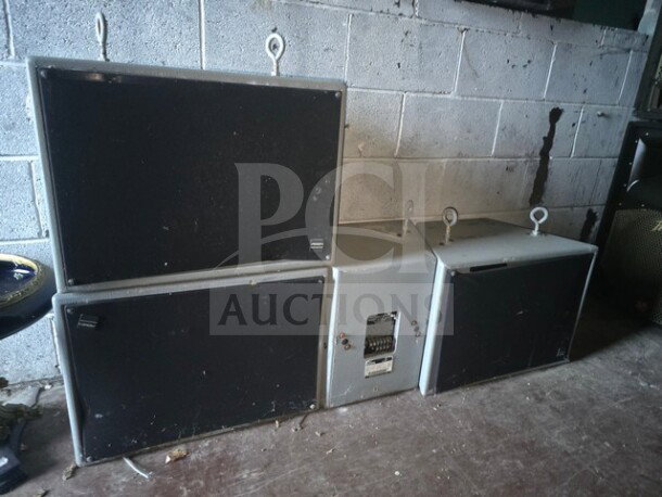 Lot of 4 Peavey Impulse 1282 speakers. Black and gray, wall-mounted. Visible wear, durability hooks attached.