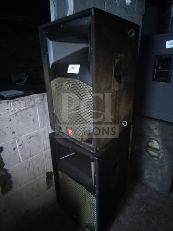 Lot of 2 Peavey SP 2 passive full-range speakers, black, showing grill design, in used condition, stacked vertically.