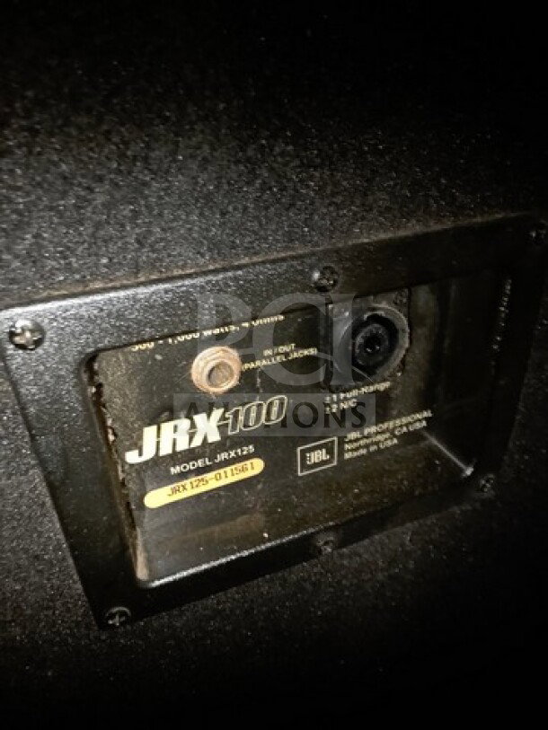 Lot of 2 JBL JRX125 dual 15-inch passive speakers, showing input panel and branding. Sold as is.