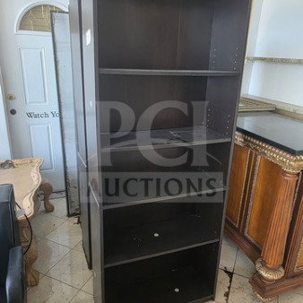 Lot of 3 dark wood bookcases with five shelves each, in good condition. Minimal wear visible, ready for use.