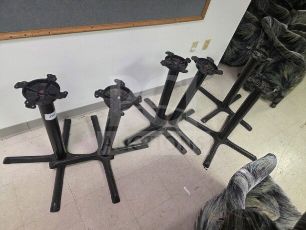 Lot of 6 metal table bases, black finish, one base measuring 30x30 inches. Good condition, suitable for café tables.
