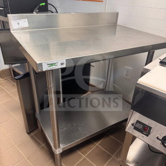 Regency 36" stainless steel work table with backsplash and undershelf, excellent condition, NSF certified label visible.