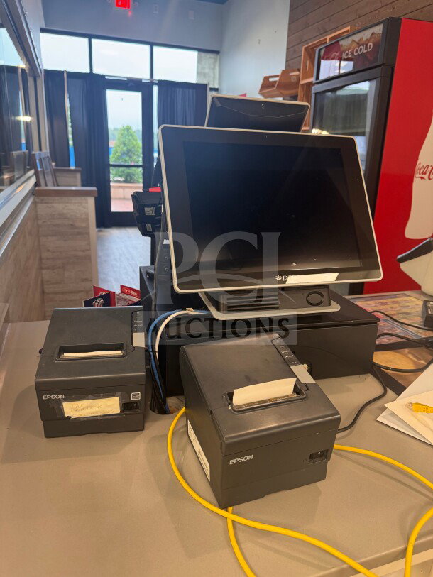 Point of Sale system with cash drawer, three Epson receipt printers, and payment terminal. Untested, sold as-is. Includes cables.