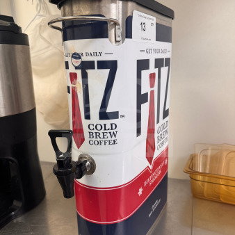 Fitz Cold Brew Coffee dispenser with spout, branded labeling, metal handle, and lid. Condition appears used.
