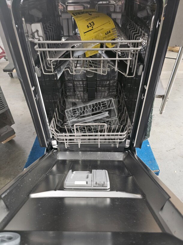 New Honeywell residential dishwasher, stainless steel interior, energy label visible, open box condition.