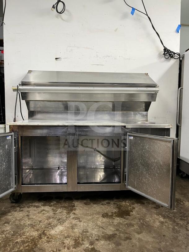 Marsal & Sons steel refrigerated pizza prep table, model 'pizza prep', with stainless steel finish and open doors, in used condition.
