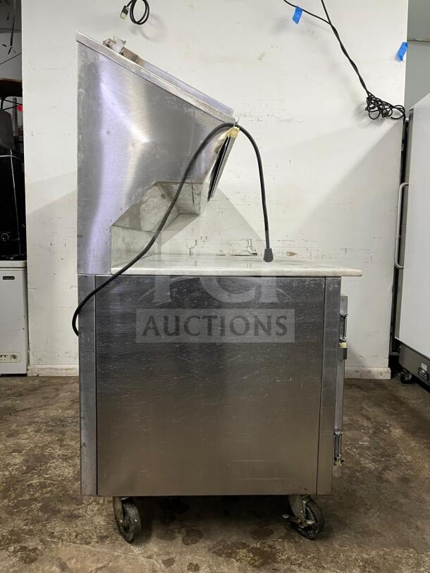 Marsal & Sons pizza prep table, steel construction, refrigerated, model: pizza prep, on casters, used condition.