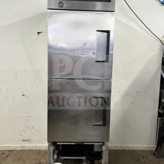 TRUE T-23-2 refrigerator, 27" with two left hinge solid doors, visible wear, model T-23-2, 115V, on casters.