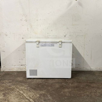 Magic Chef deep freezer, white exterior, secure latches, visible label with specs, in used condition, for auction.