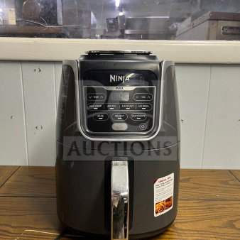 Ninja AF161 Air Fryer Max XL; black with silver handle, digital display, multiple cooking modes. Good condition.