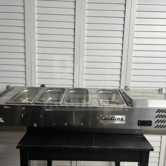Coldline CTP60SS 60" refrigerated salad bar with six stainless steel pans, top cover, minor wear, brand label visible.