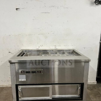 Stainless steel prep table with integrated salad bar, featuring multiple compartments, control panel, and sliding door storage.