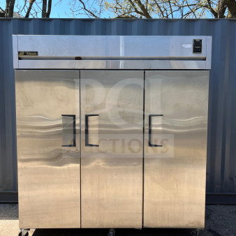 TRUE TR3F-3S three-section solid door reach-in freezer, stainless steel, 78", model TR3F-3S, on casters, outdoors.