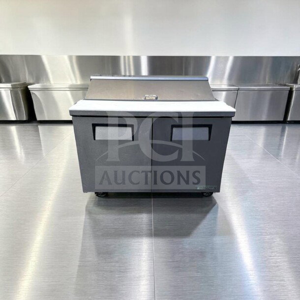 True TSSU-48-12-HC sandwich/salad prep table in top-tier condition, 48" refrigerated base, fully tested, 115V.