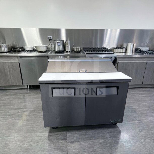 True TSSU-48-12-HC sandwich prep table, 48", refrigerated base, top-tier condition, tested, 115V, stainless steel finish.