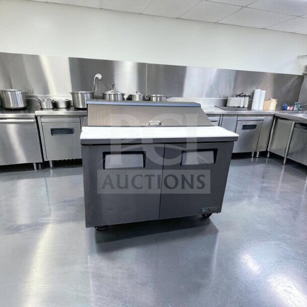 True TSSU-48-12-HC prep table in top-tier condition, refrigerated base, 48", 115V, fully tested, stainless steel finish.