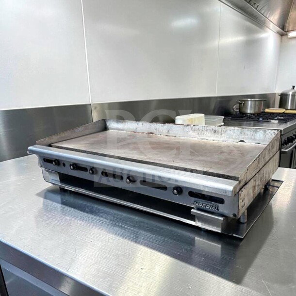 Alt text: Imperial ITG-60 60" commercial gas griddle, 1" steel plate, thermostatic controls, natural gas, superior condition.