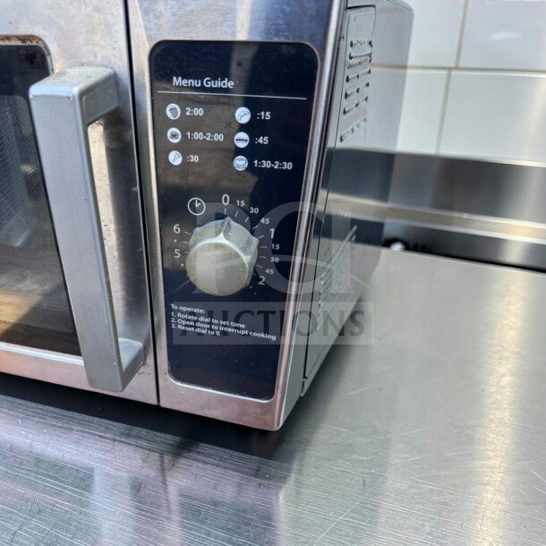 Amana RCS10DS Commercial Microwave Oven, 1000W, stainless steel, exceptional condition, medium volume, 120V, menu guide knob visible.