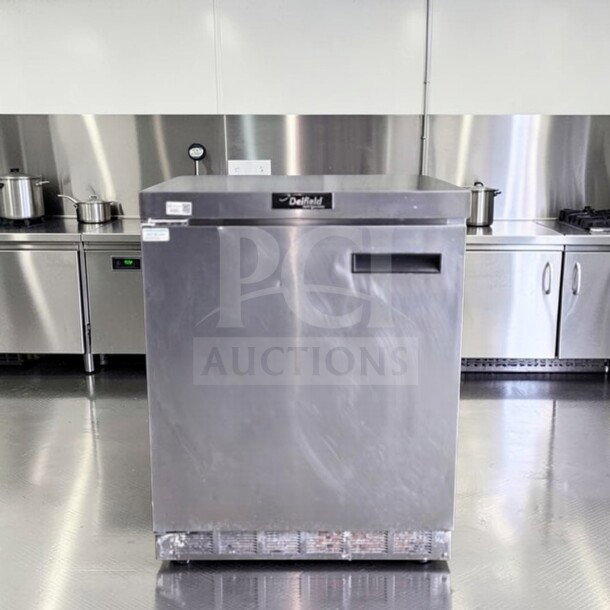 Delfield 4427 undercounter refrigerator, 27" stainless steel, 1 door, prime condition, fully tested, in commercial kitchen setting.