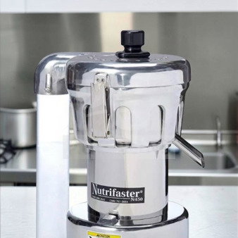 Nutrifaster N450 Commercial Juicer, stainless steel, elite condition, heavy-duty, fully tested. Model and safety labels visible.