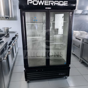 True GDM-43EM commercial glass door merchandiser refrigerator with two doors in excellent condition, fully operational.