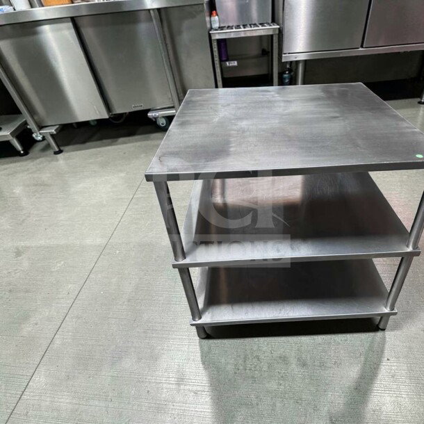34" x 34" stainless steel commercial work table with double shelves, superior condition, fully tested, heavy-duty.