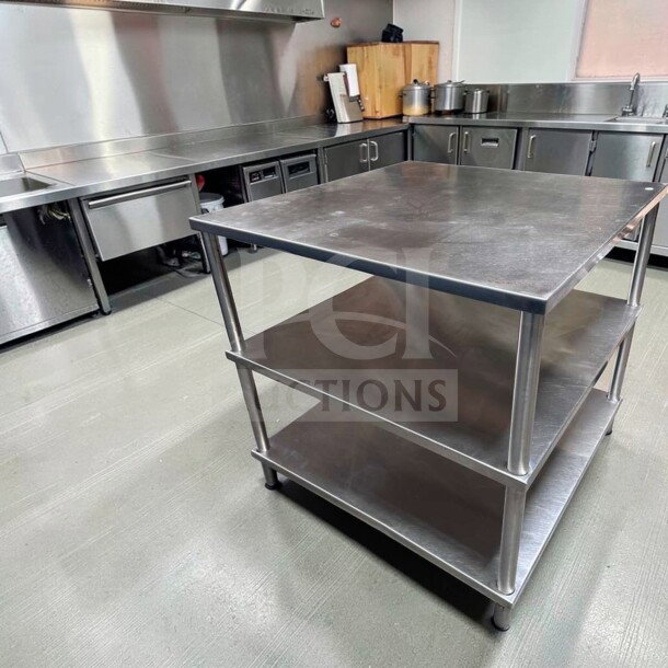 Stainless steel 34" x 34" commercial work table with double shelves, superior condition, ideal for food prep stations.