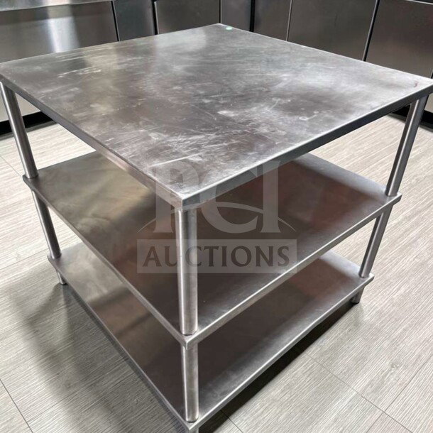 34" x 34" stainless steel commercial work table with double shelves, superior condition, heavy-duty for food prep, tested.