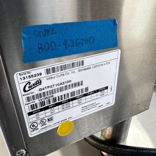 Wilbur Curtis G4TP2T10A3100 G4 ThermoPro Twin Coffee Brewer label showing model, serial number 13155239, 220V, stainless steel.