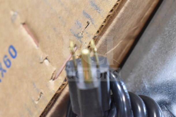 Power cord and cardboard packaging of the Imperial Range Pro Series IR-6-G24-CC, showing close-up details.