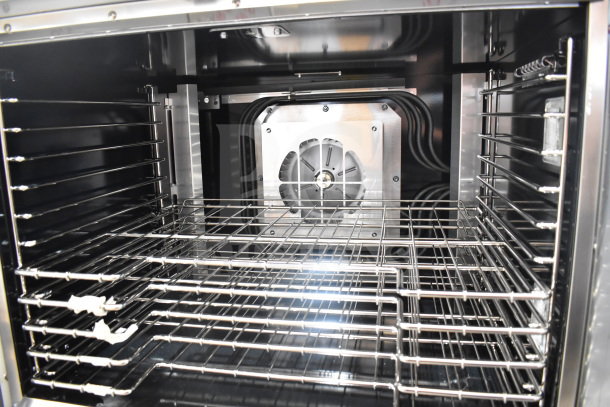 Brand new 2025 Vulcan VC4ED full-size convection oven interior; stainless steel racks, view-through doors, 208V, 1/3 phase.