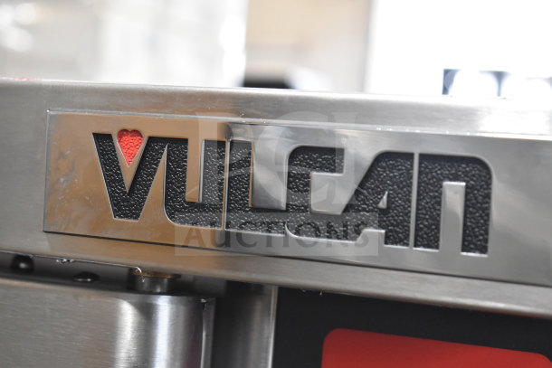 "Vulcan VC4ED-11D1 commercial convection oven logo on stainless steel surface, brand new with scratch and dent label."