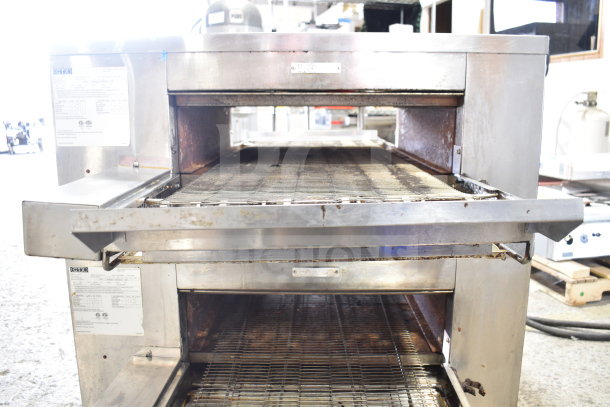 Two 2022 Middleby Marshall CTX DZ33T stainless steel conveyor pizza ovens on casters. Electric, 208V, tested and working.