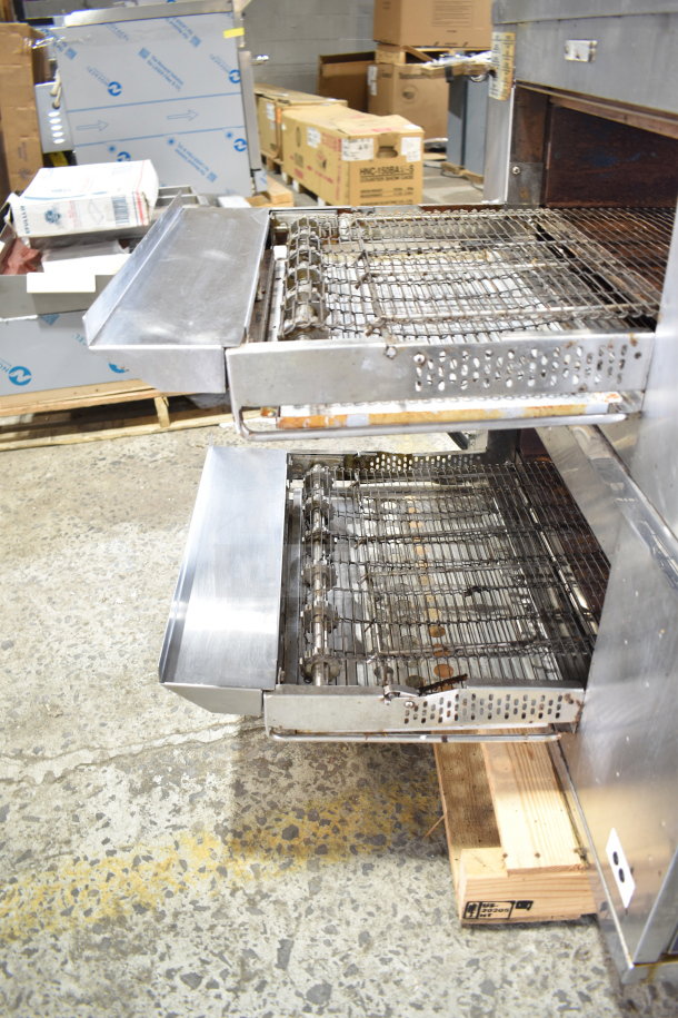 Two 2022 Middleby Marshall CTX DZ33T stainless steel conveyor pizza ovens on casters; tested and working.