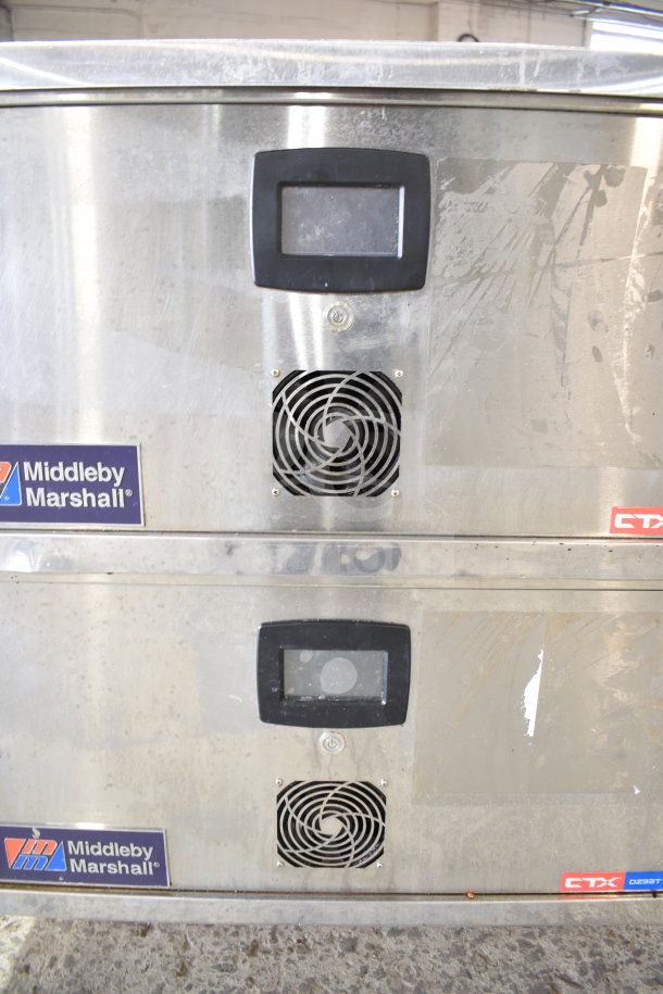 Two 2022 Middleby Marshall CTX DZ33T stainless steel commercial conveyor pizza ovens on casters, 208 volts, tested and working.