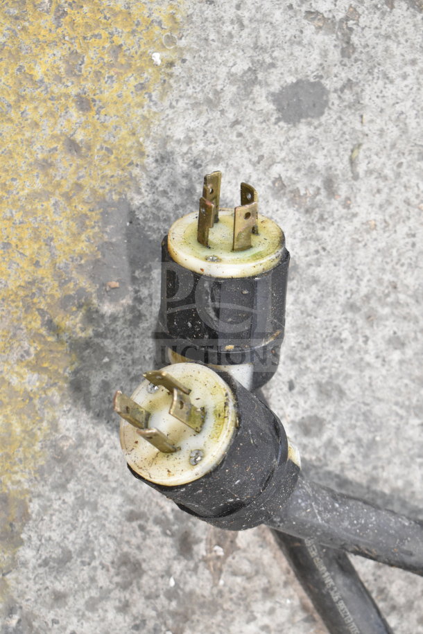 Close-up of electrical plugs from a 2022 Middleby Marshall CTX DZ33T conveyor pizza oven, showing wear and use.