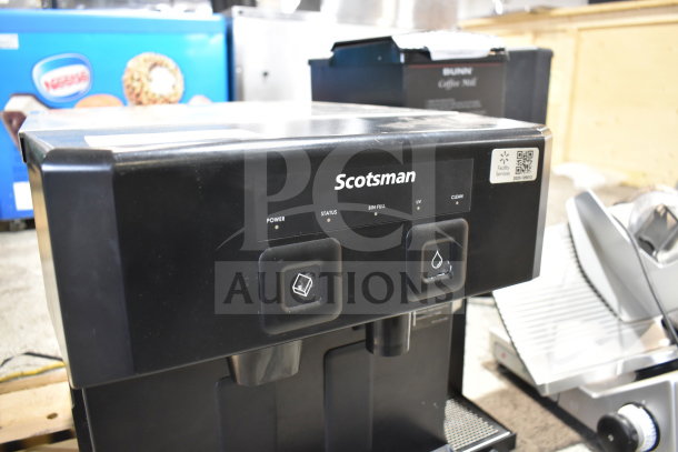 Brand new Scotsman W-HID207ABX-1A countertop water and nugget ice dispenser, 196 lb capacity, 7 lb storage, push-button cup fill.
