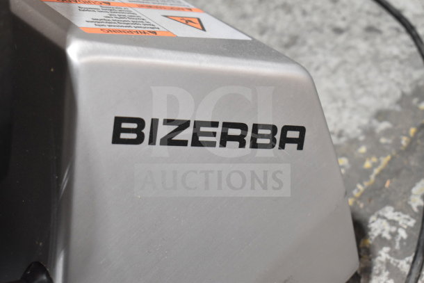 Bizerba commercial meat slicer, new with scratch and dent. Includes blade sharpener. 120V, 1 Phase.