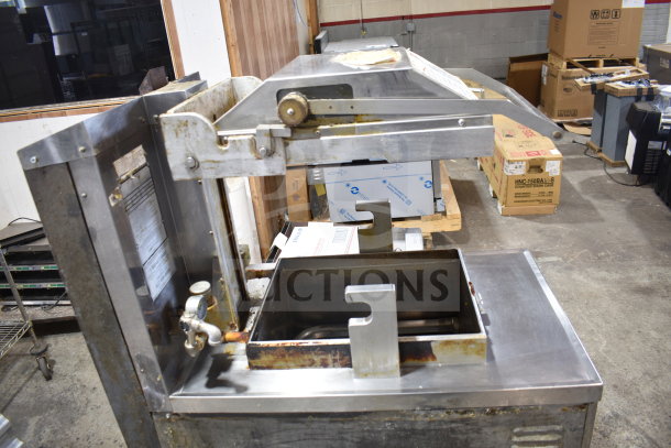 Commercial Henny Penny PFG-690 Computron 8000 pressure fryer on casters, showing wear and rust, 100,000 BTU, gas-powered.