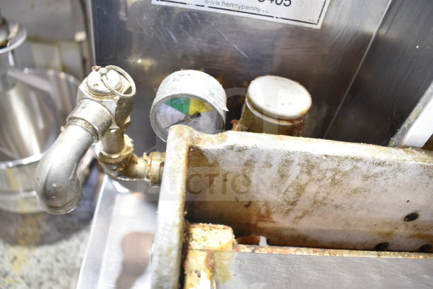 Henny Penny PFG-690 Computron 8000 pressure fryer, showing gauge and weathered metal finish. 100,000 BTU, natural gas powered.