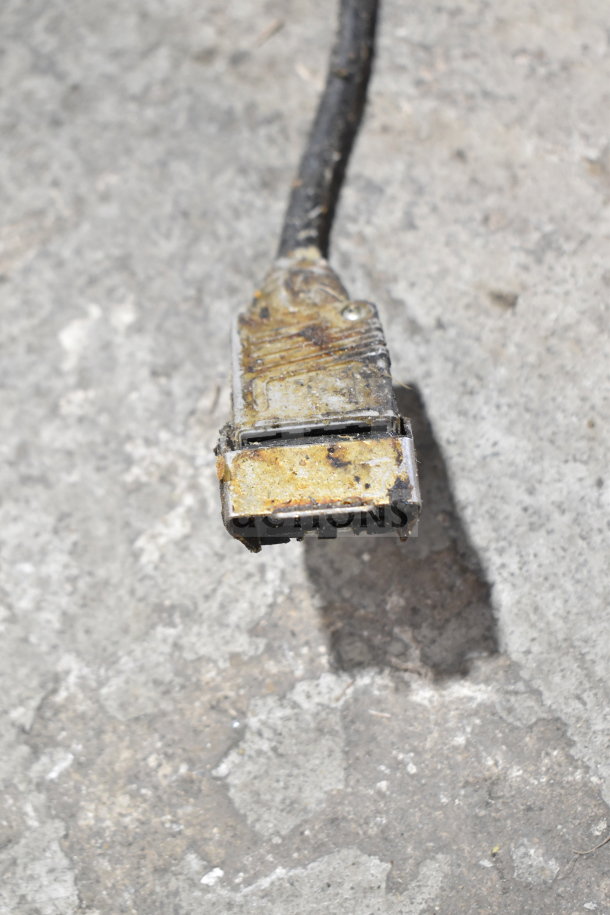 Alt text: Close-up of a worn connector plug on a Henny Penny PFG-690 pressure fryer, showcasing condition details.