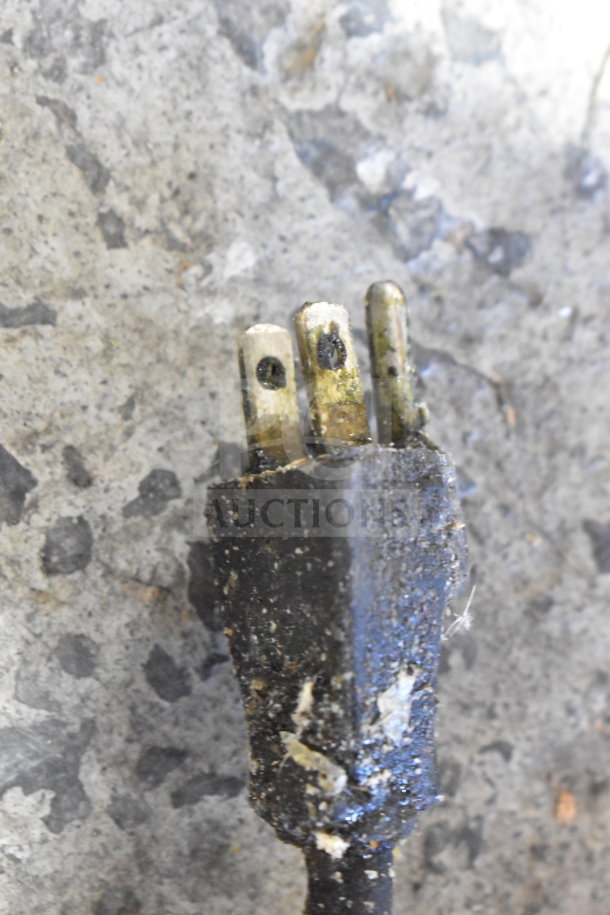 Close-up of a worn electrical plug on the Henny Penny PFG-690 Computron 8000 fryer. Visible discoloration and wear.